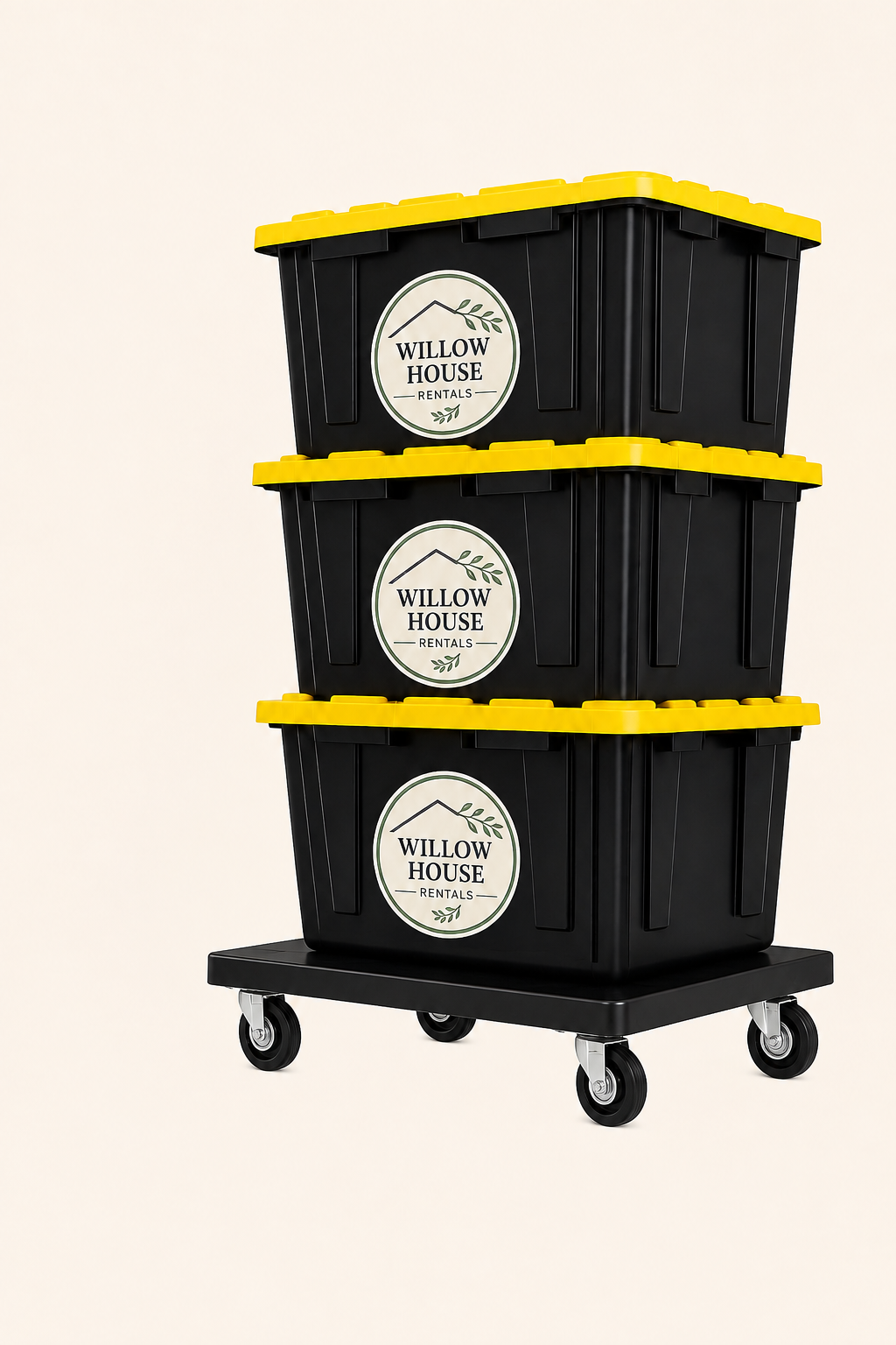 Three black moving totes with yellow lids and Willow House Rentals labels stacked on a black rolling dolly